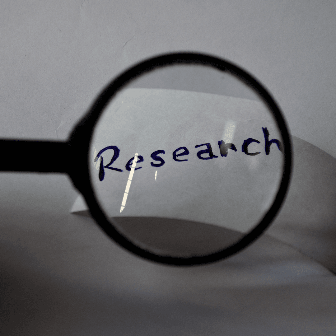 Photo of magnifying glass over the word "research" Opens in new window