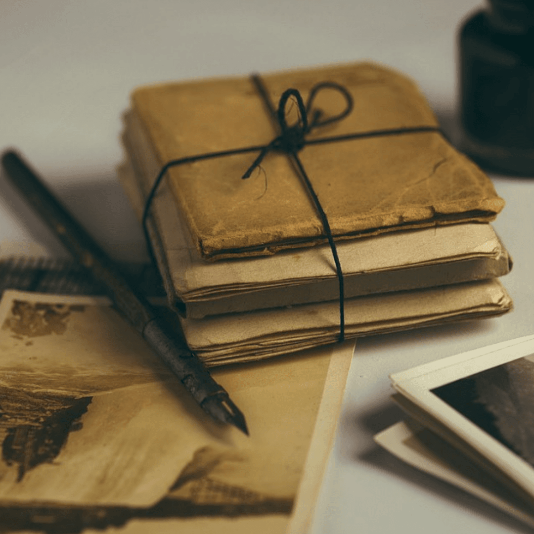 Photo of letters bundled and calligraphy pen Opens in new window
